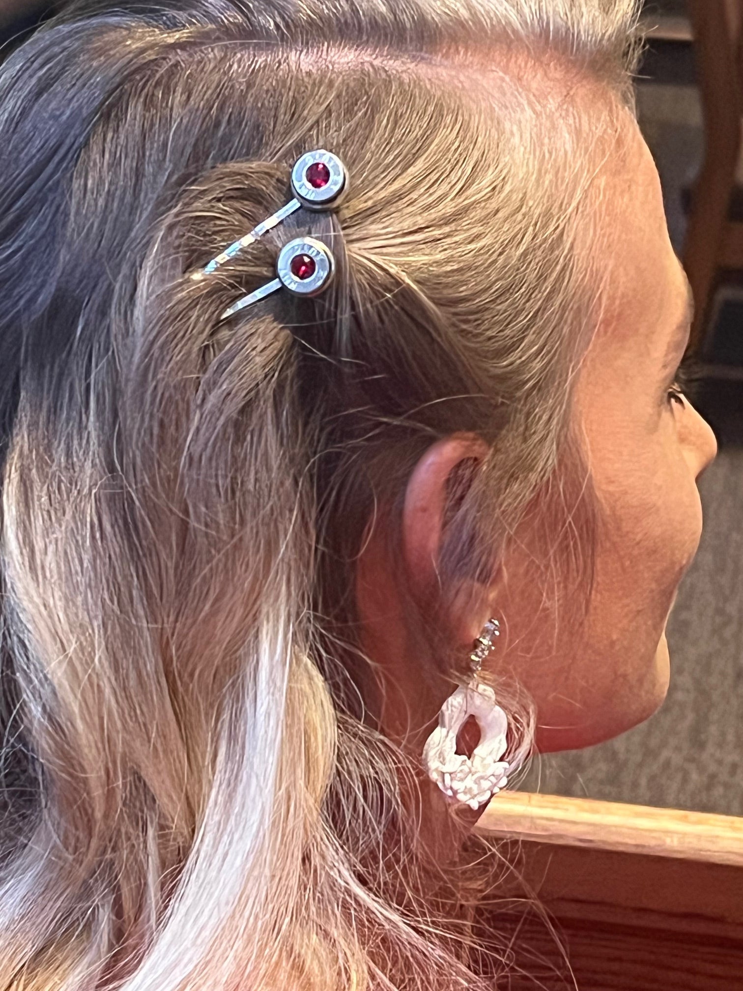 model is wearing bobby pin 45acp ruby