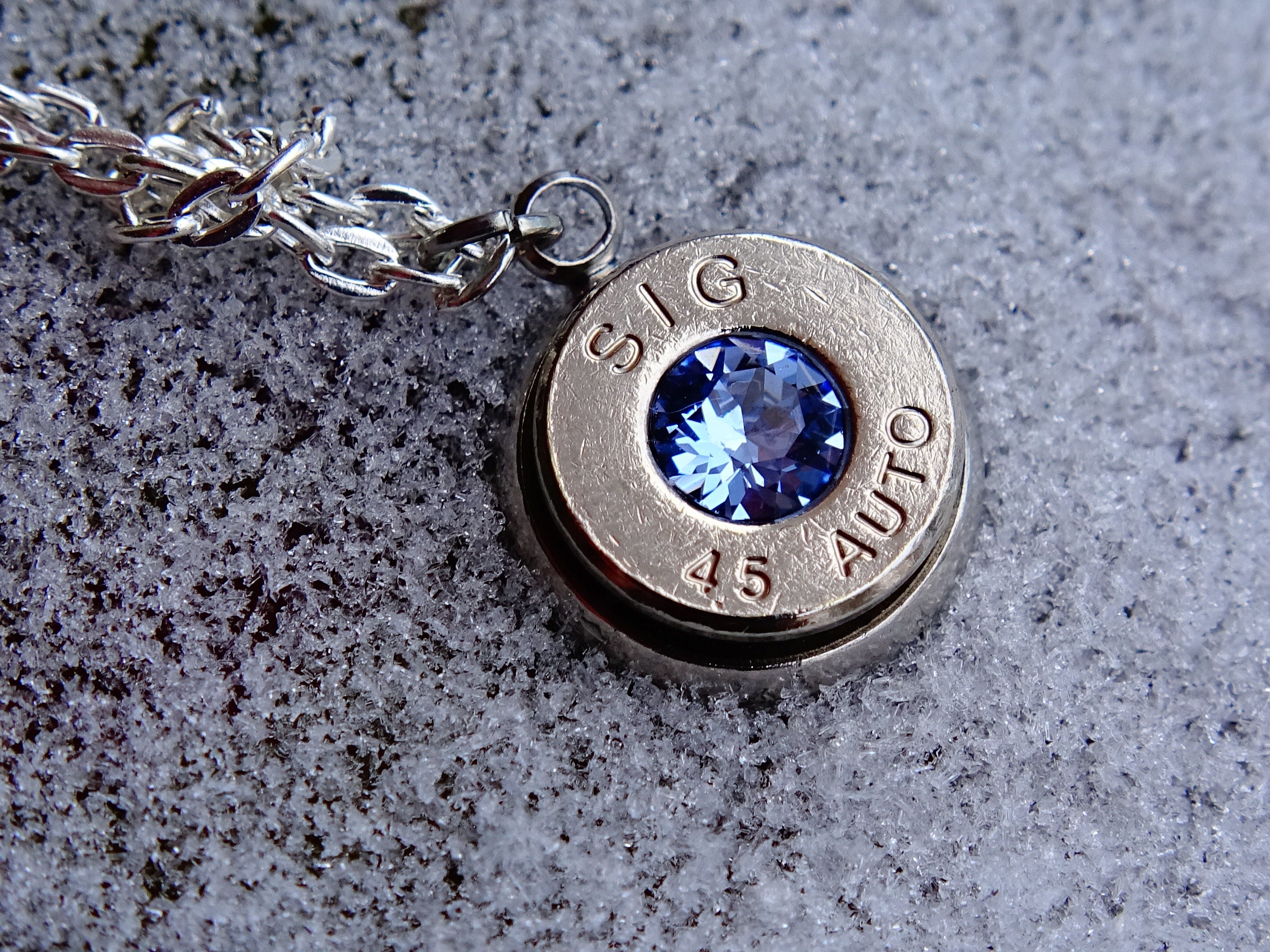 10mm bullet earrings & 45 ACP pendant set swarovski ice blue light sapphire (etsy image id: 2125540524)