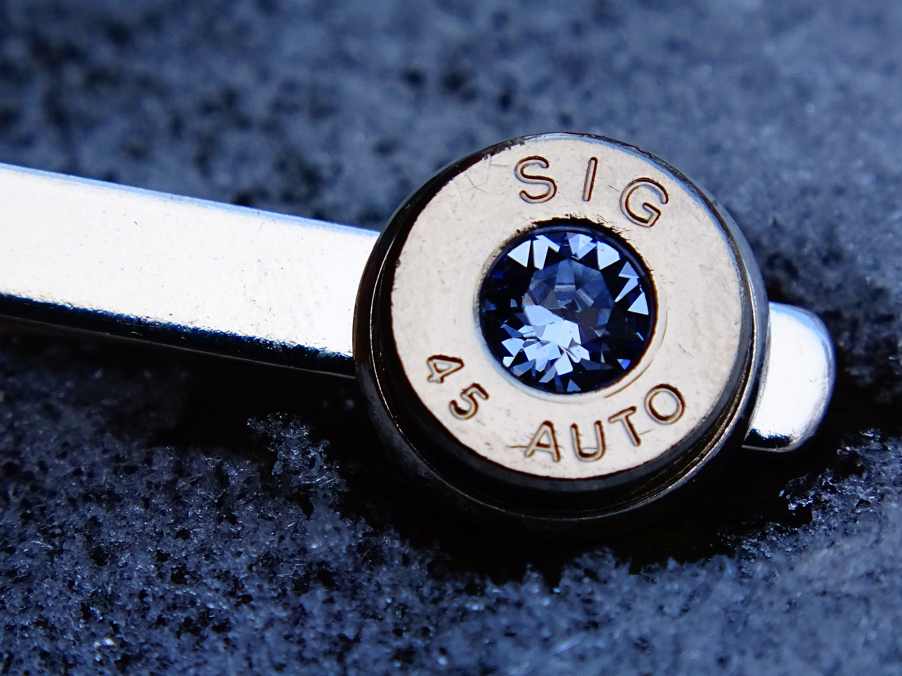 45 ACP silver tone bullet tie clip swarovski ice blue sapphire (etsy image id: 2125550814)