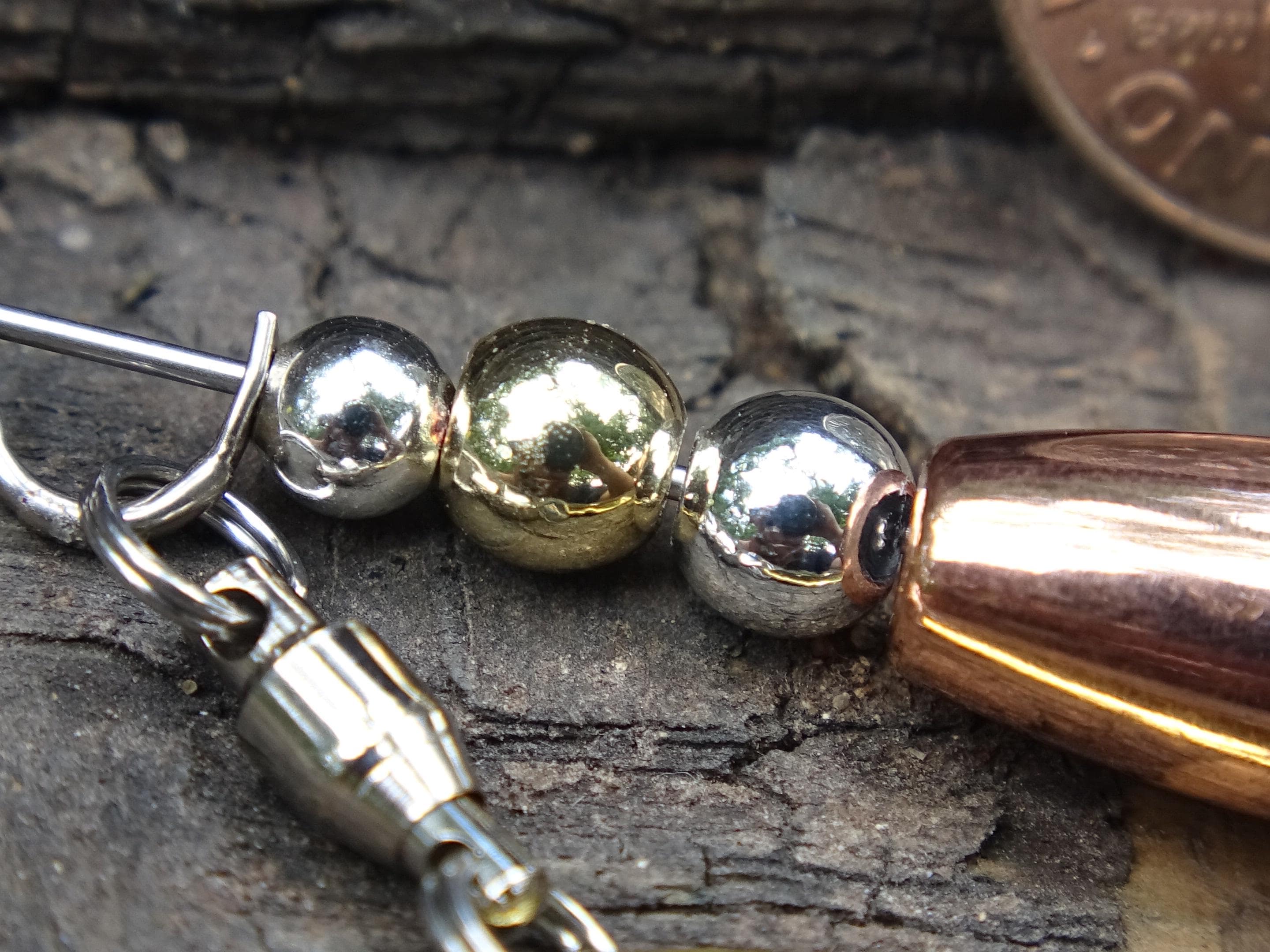 James Henry .30 caliber bullet fishing lure Gold Standard 14k filled bead .925 filled bead (etsy image id: 7019777914)